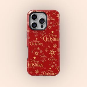 May include: A red phone case with a gold "Merry Christmas" pattern. The design includes snowflakes and stars. The case has a camera cutout and black side buttons.