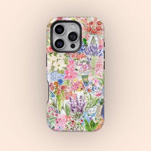 May include: A phone case with a floral design, showcasing a colourful collage of watercolour flowers. The design includes bouquets of lavender and other blooms in shades of pink, purple, and white, creating a fresh and artistic aesthetic.