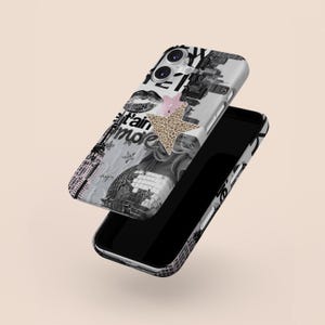 May include: A black smartphone with a decorative case featuring a collage of images and text in black, white, and grey. The design includes a disco ball, lips, and a star with a leopard print pattern. A pink star is also present.