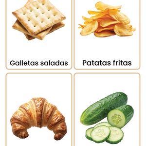 May include: Four food flashcards. Top left: Stack of square crackers. Top right: Pile of golden potato chips. Bottom left: Flaky croissant. Bottom right: Cucumber with slices. Text: "Galletas saladas", "Patatas fritas", "Croissant", "Pepino".