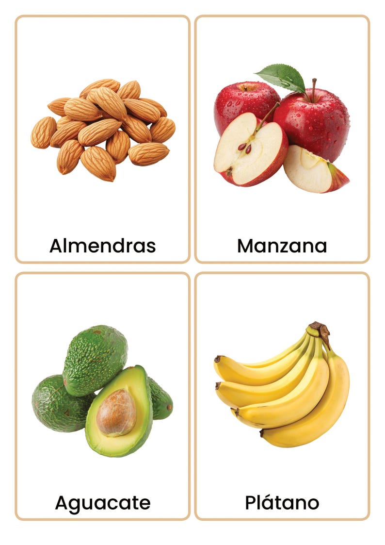 May include: Four flashcards displaying food items. The top left card shows a pile of almonds, the top right card shows red apples, one sliced. The bottom left card shows avocados, and the bottom right card shows bananas. Each card has a food name in Spanish.