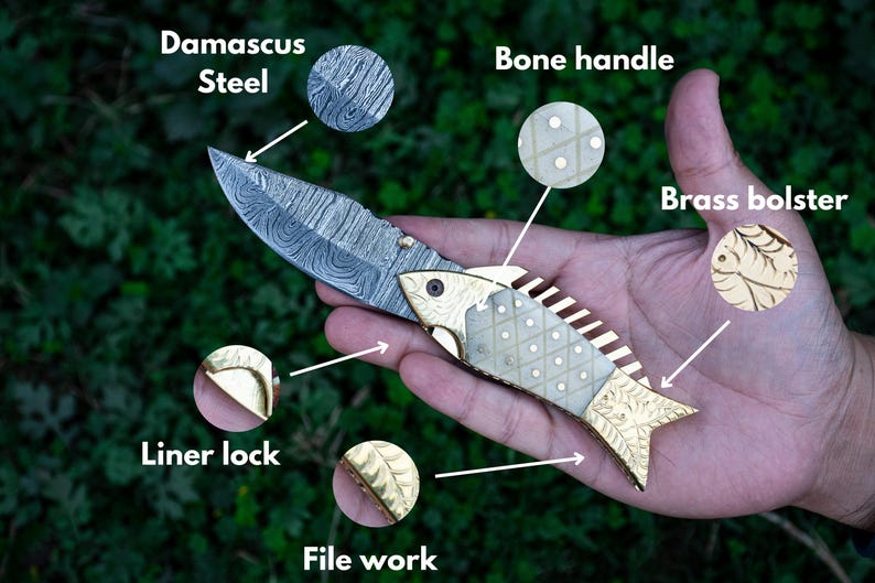 May include: A folding knife with a Damascus steel blade, bone handle, and brass bolster. The handle is decorated with a fish design and has a liner lock. The blade has a file work pattern.