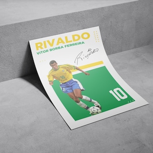 May include: A poster featuring Brazilian soccer player Rivaldo in a yellow and blue uniform, kicking a soccer ball. The poster has a green and white background with the number 10 and the player's signature.