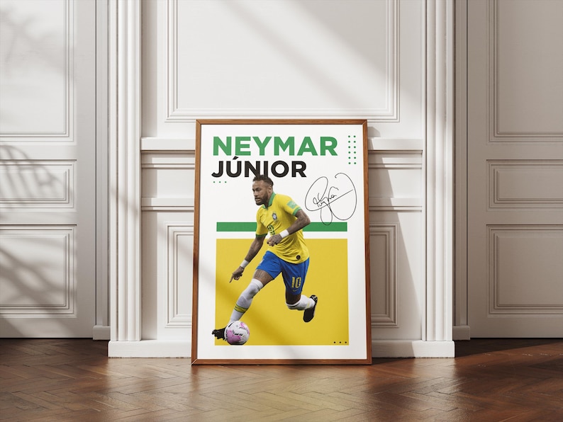 May include: A framed poster featuring Neymar J&uacute;nior in a yellow and blue soccer uniform, kicking a soccer ball. The poster includes the player's name in green and black text, along with a signature. The background is yellow and white.