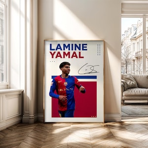 May include: A framed poster featuring Lamine Yamal in a red and blue soccer jersey. The poster has the name "LAMINE YAMAL" in blue and red text, along with a signature. The background is a mix of white and red.