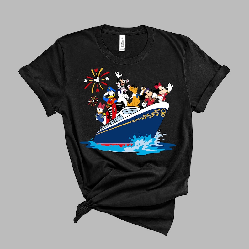May include: Black t-shirt with a graphic of Mickey Mouse, Donald Duck, Goofy, and Pluto on a blue and gold cruise ship with fireworks in the background.