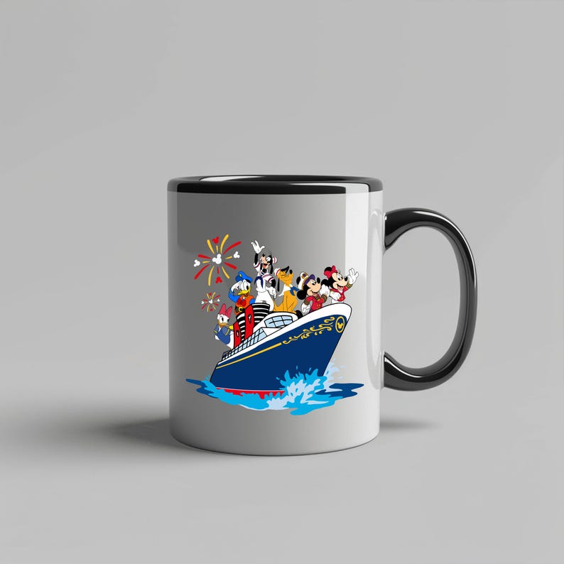 May include: White ceramic mug with a black rim and handle. The mug features a colorful illustration of Mickey Mouse, Donald Duck, Goofy, Pluto, and Minnie Mouse on a blue and white cruise ship with fireworks in the background.