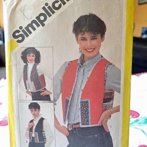 May include: A Simplicity sewing pattern for a vest, featuring three different styles. The pattern number is 5132 and the price is $3.50. The pattern is designed by Marjorie Puckett.