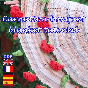 May include: A crocheted blanket with a carnation bouquet design. The blanket features red carnation flowers and green leaves along the edges. The text "Carnation bouquet blanket tutorial" is displayed in blue. The blanket is made of cream, white, and tan yarn.