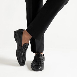 Handcrafted woven leather penny loafers for men in jet black color featuring luxury braided texture, comfortable slip-on construction, elegant formal shoe styling, Italian-inspired moccasin design, and premium men’s wedding and office footwear by TheHideNStyle.