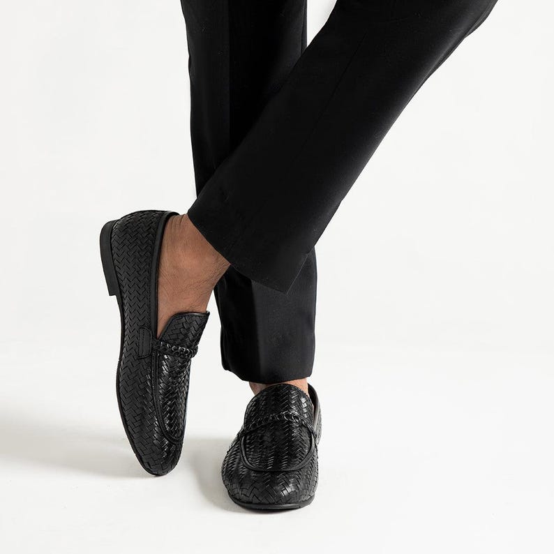 Handcrafted woven leather penny loafers for men in jet black color featuring luxury braided texture, comfortable slip-on construction, elegant formal shoe styling, Italian-inspired moccasin design, and premium men’s wedding and office footwear by TheHideNStyle.