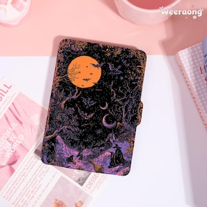 May include: A black and purple Halloween-themed case featuring a full moon, bats, and a witch. The case has a magnetic closure and a detailed illustration of a spooky forest scene. The case is designed to protect a tablet or e-reader.