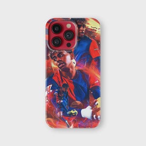 May include: A phone case featuring a collage of a soccer player in action, set against a fiery red and orange background. The player is wearing a blue and red jersey. The case has a glossy finish.