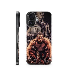 May include: Clear phone case featuring a mixed martial artist in a fighting stance. The design includes a portrait of the athlete, a championship belt, and a cage background. The case is black on the sides.