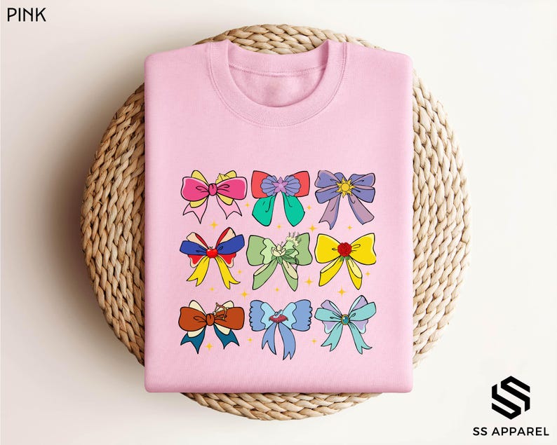 a pink tshirt with bows on it