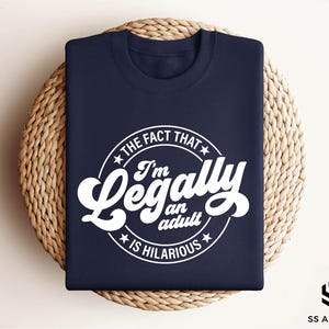 a navy t - shirt that says i'm legally an actual