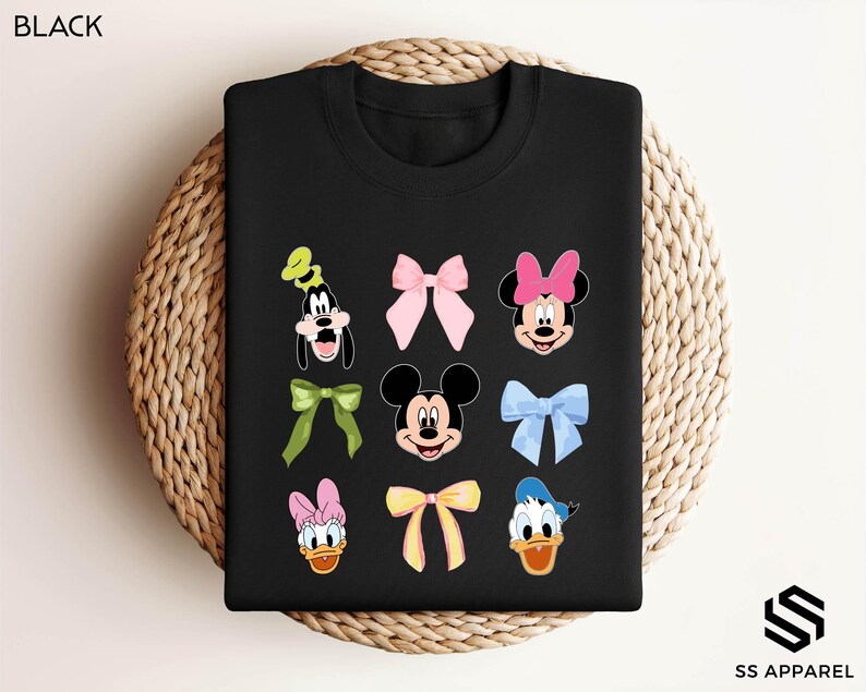 a black tshirt with mickey and minnie mouses on it