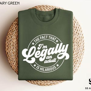 a military green t - shirt with the words i'm legally fabulous printed on