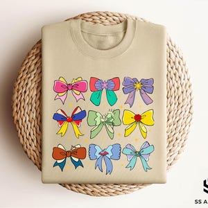 a t - shirt with a bunch of bows on it