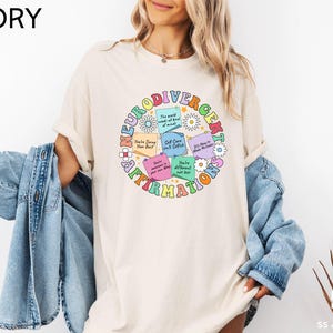 a woman wearing a white t - shirt with words on it