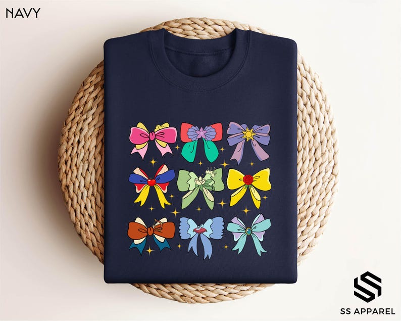 a navy blue t - shirt with colorful bows on it