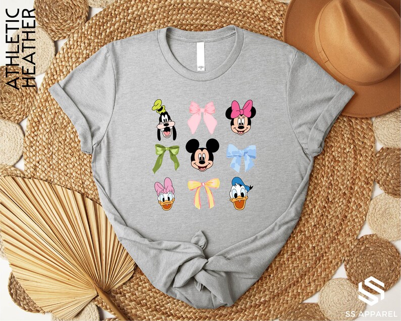 a gray shirt with mickey and minnie mouses on it