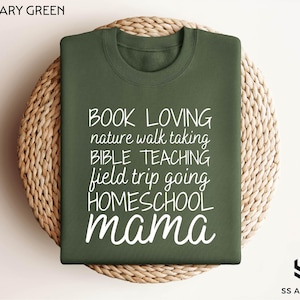 a green t - shirt that says book loving nature walking bible teaching field trip going