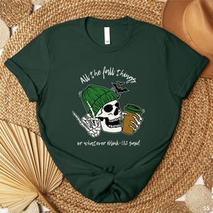 a green shirt with a skull wearing a green hat