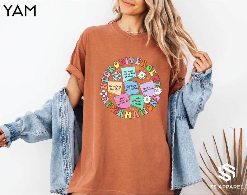 a woman wearing a brown t - shirt with words on it
