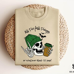 a t - shirt with a skull wearing a green hat