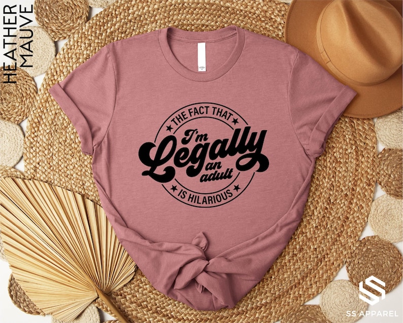 a pink t - shirt that says i'm not that legally