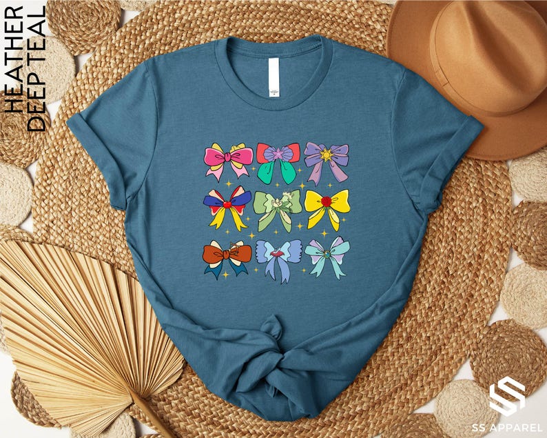 a blue t - shirt with bows on it