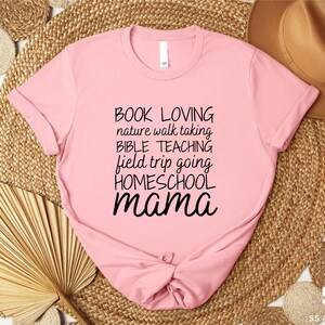a pink shirt with the words book loving and a bow on it