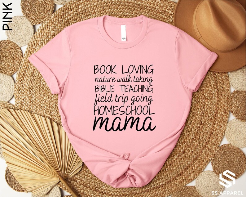 a pink shirt with the words book loving and a bow on it