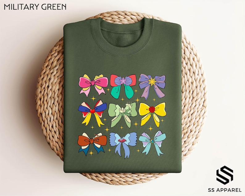 a military green shirt with bows on it