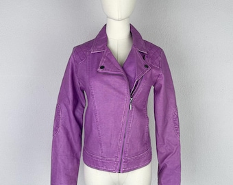 May include: A vibrant purple moto-style jacket featuring an asymmetrical front zipper closure, a notched collar, and quilted detailing on the shoulders and elbow patches. The jacket has long sleeves and a fitted silhouette with visible seam stitching.