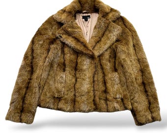May include: A brown faux fur jacket with a striped pattern. The jacket has a collar and a zipper closure.