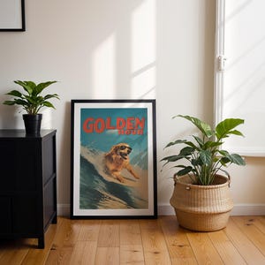 May include: A framed poster with the words "GOLDEN HOUR" in red text. The poster features a golden retriever dog wearing sunglasses surfing a wave. The poster is in a black frame and is leaning against a white wall.