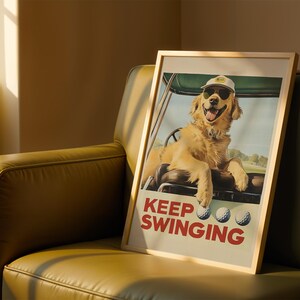 May include: A framed poster featuring a golden retriever wearing a golf cap and sunglasses, sitting in a golf cart. The poster has the text "Keep Swinging" in red and white letters.