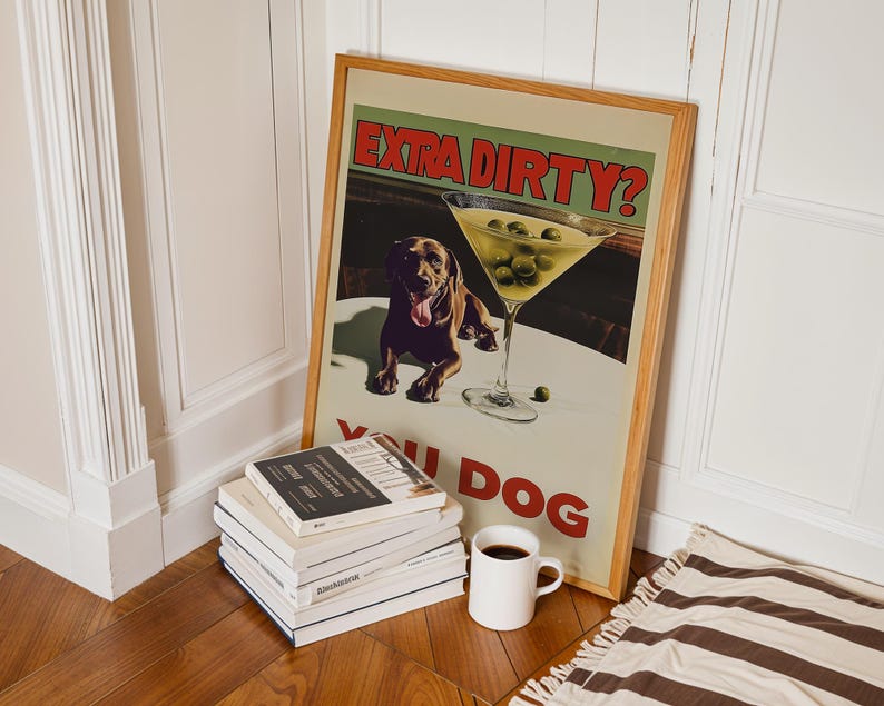 May include: A framed poster with a brown dog and a martini glass with olives. The poster says "Extra Dirty? You Dog".