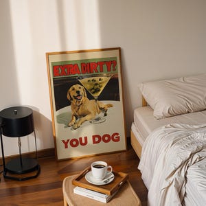 May include: A framed poster with a yellow dog and a martini glass with olives. The poster says "Extra Dirty? You Dog".
