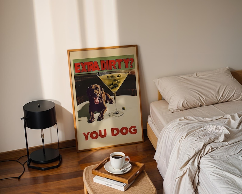 May include: A framed poster with a brown dog and a martini glass with olives. The poster has the text "Extra Dirty? You Dog" in red and black letters.
