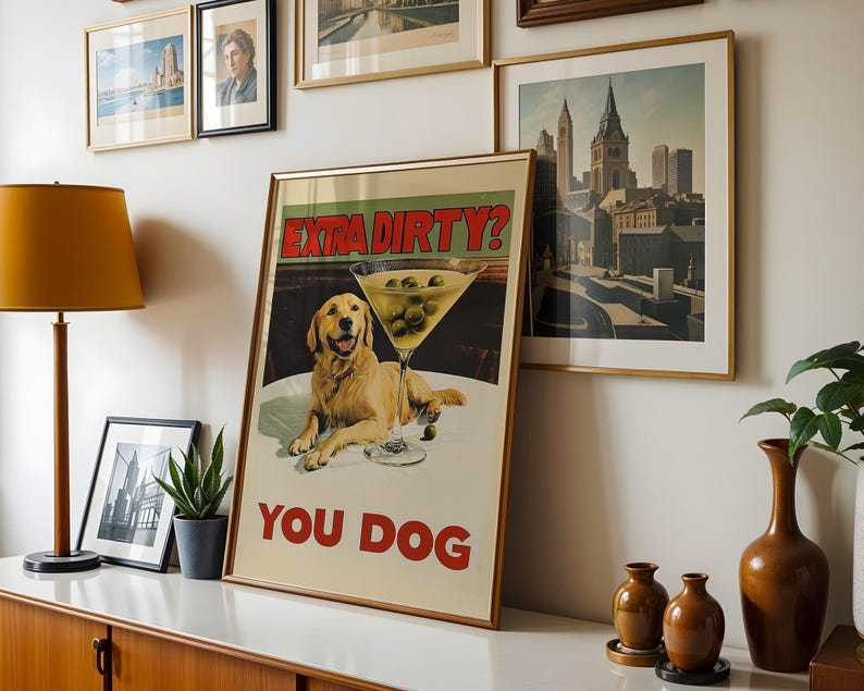 May include: A vintage poster with a golden retriever dog and a martini glass with olives. The poster has the text "Extra Dirty? You Dog" in red and white.