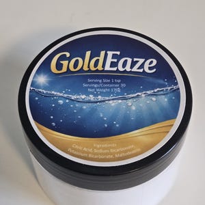 May include: A white container with a black lid, featuring a label with the text "GoldEaze." The label has a blue and gold design with the text "Serving Size 1 tsp, Servings/Container 30, Net Weight 6 oz." Ingredients listed include Citric Acid and Sodium Bicarbonate.