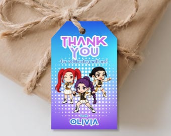 May include: A gift tag with a blue and purple gradient background, featuring the text "THANK YOU" and "for celebrating with me!". Below are cartoon illustrations of three figures. The tag is tied to a wrapped gift with twine.