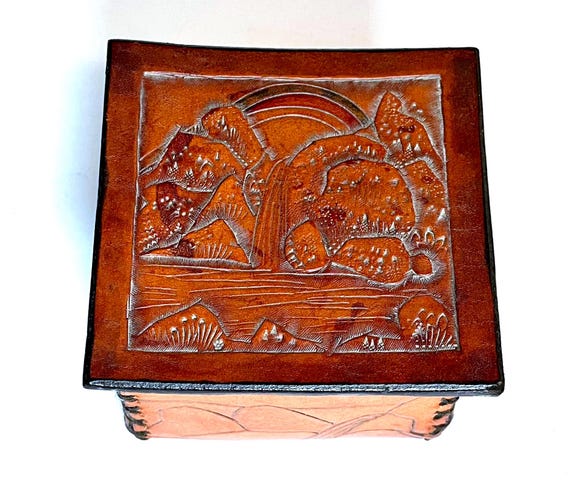 A genuine 1970s hand-tooled leather trinket box — real vintage provenance means no two are alike, and that aged patina is something you simply can't manufacture today.