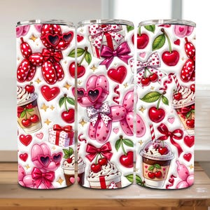 May include: Three white insulated tumblers with a repeating pattern of pink balloon dogs wearing heart-shaped sunglasses, red cherries, hearts, and gift boxes. The design includes whipped cream desserts and bows.