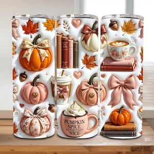 May include: A white tumbler featuring a repeating pattern of orange and pink pumpkins with bows, autumn leaves, acorns, hearts, stacks of books, and coffee cups. One mug is labeled with the text PUMPKIN SPICE & EVERYTHING NICE in black letters.