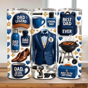 May include: A white tumbler featuring various Father's Day themed graphics. Designs include a blue baseball cap with "DAD LEGEND", a blue suit, a backpack with "BEST DAD EVER", and tools. The tumbler also has blue hearts and gold stars.