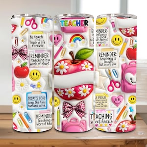 May include: A white tumbler with a teacher-themed design. The design includes an apple, daisies, pencils, scissors, and the text "TEACHER". Other text includes "to teach is to touch a life forever" and "teaching is a work of heart".